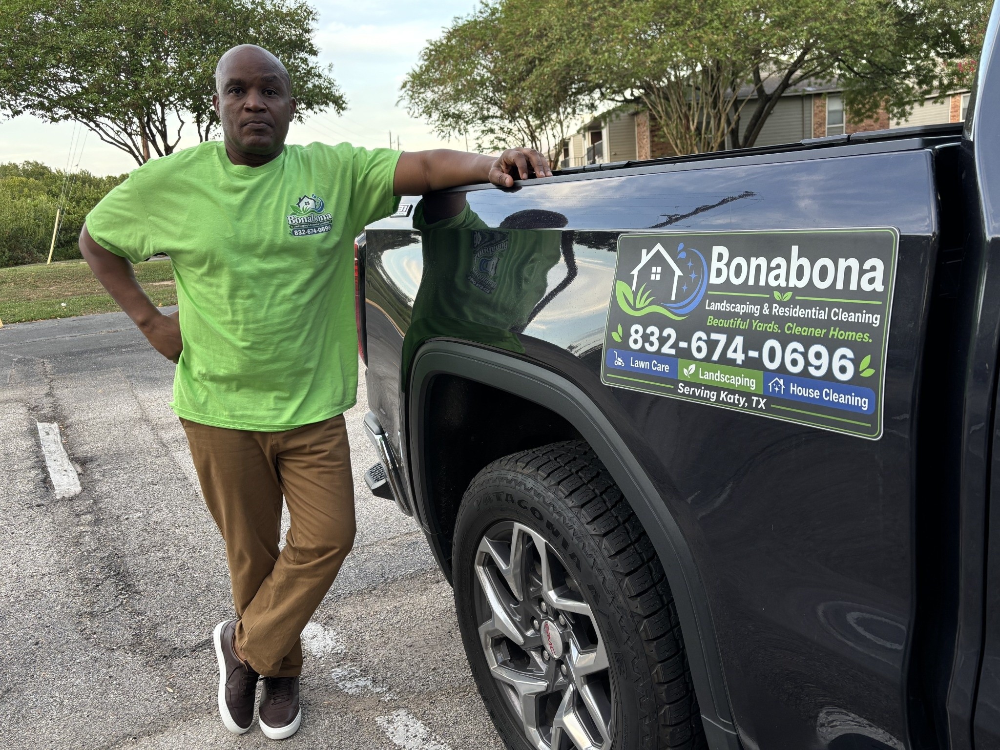 The actual founder of Bonabona Landscaping & Residential Cleaning beside his GMC Sierra