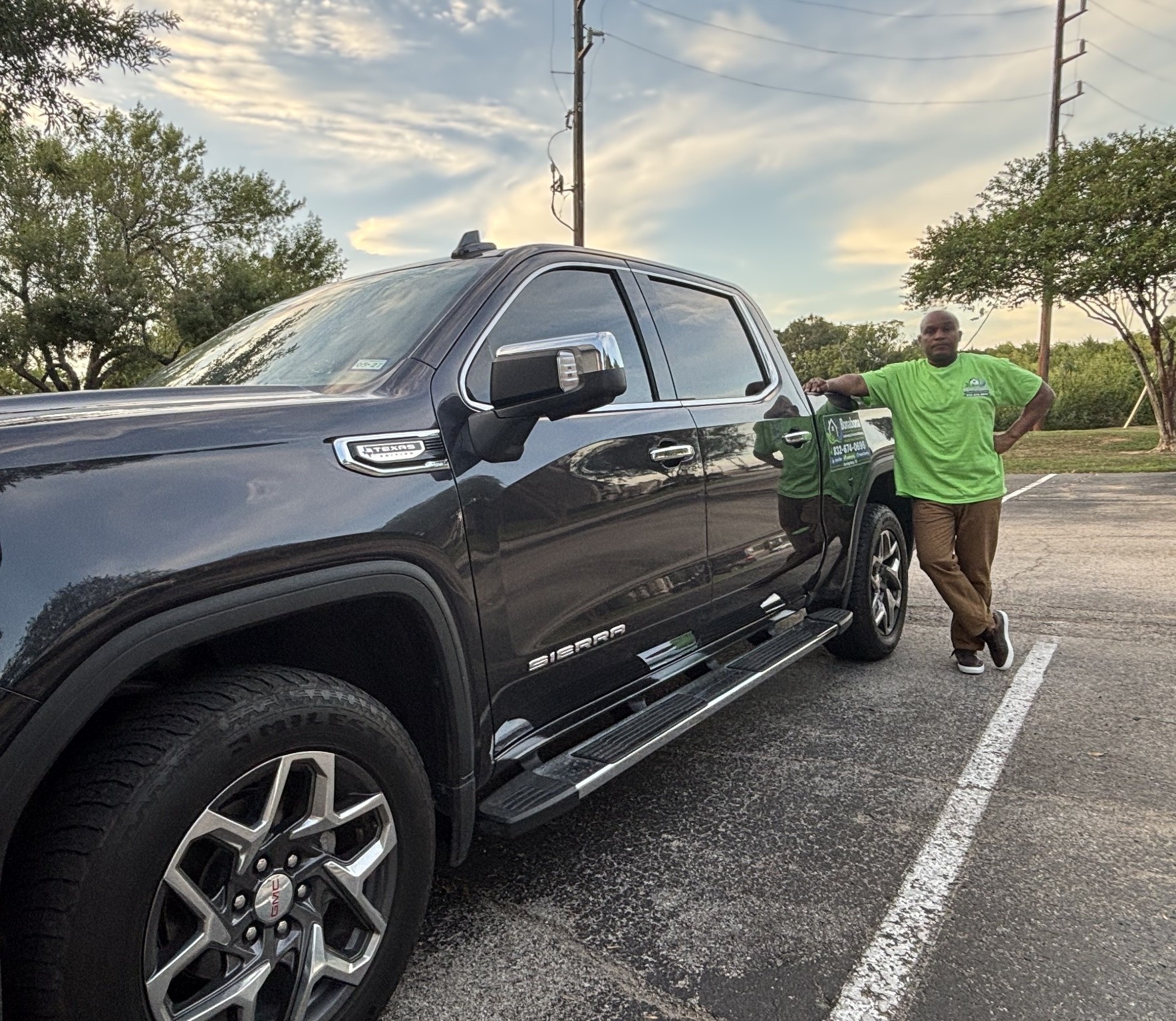 Bonabona's founder beside the company's GMC Sierra service truck